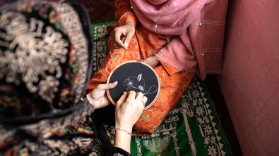 CH1748987-Nasreen-s-teacher-shows-her-how-to-embroider-at-Save-the-Children-s-vocational-training-centre-in-Afghanistan.jpg