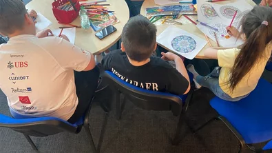 CH1678749-Children-participating-in-craft-activities-with-a-psychologist-in-the-child-safe-space-at-the-refugee-reception-centre-Poland.jpg