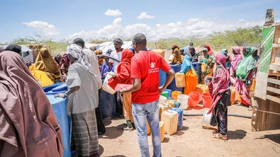 CH1822211-People-queuing-to-get-clean-water-provided-by-Save-the-Children-after-floods-destroyed-infrastructure-in-Southern-Somalia.jpg