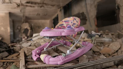 CH1909334-A-child-rocking-chair-among-a-rubble-in-Gaza
