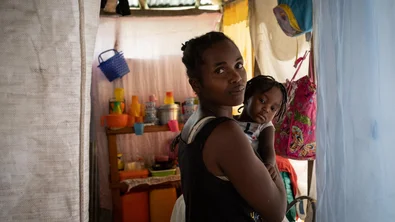 Ginette holds her daughter Loisa