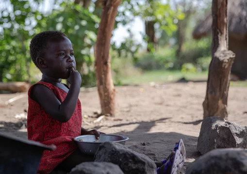 CH1508067-Mary-22-months-old-eats-at-home-in-a-refugee-settlement-in-West-Nile-Uganda