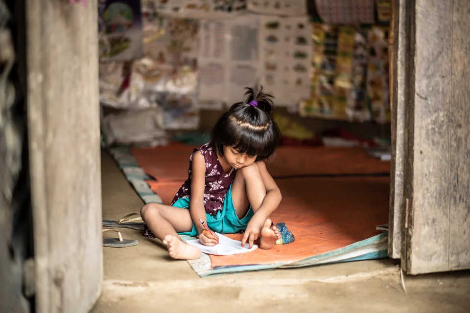 child-writing-at-a-school