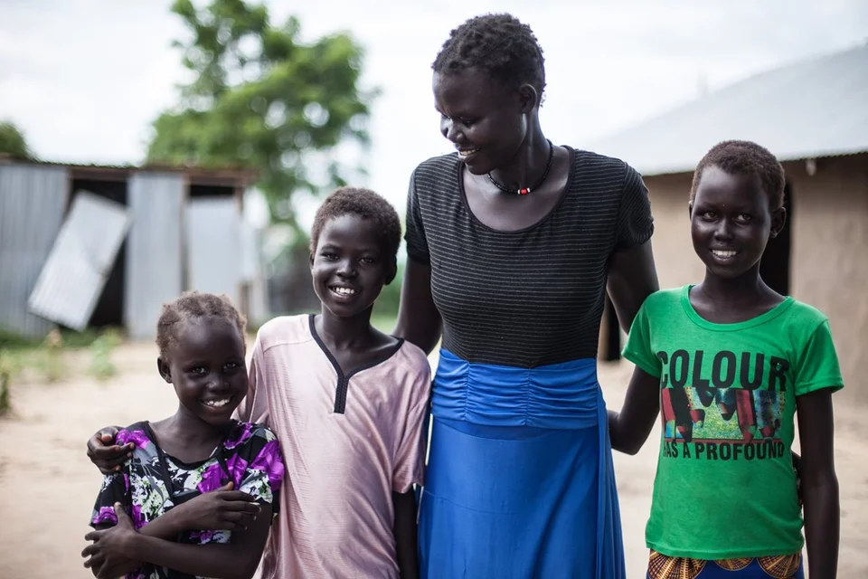 CH186452-Amou-reunited-with-her-daughers-Awel-12-Nyandeng-10-and-Athiei-8-at-home-in-South-Sudan.aspx%3Fwidth%3D1200%26height%3D800%26ext%3D.jpg.webp