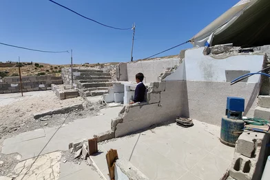CH1548037-Lee-6-looking-at-the-rubble-after-his-home-was-demolished-in-South-Hebron-West-Bank.png