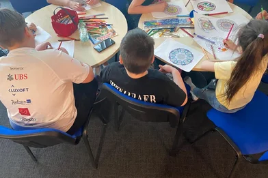 CH1678749-Children-participating-in-craft-activities-with-a-psychologist-in-the-child-safe-space-at-the-refugee-reception-centre-Poland.jpg