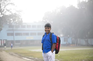 CH1651500-Sohan-9-smiles-on-his-way-to-school-in-Rajbari-District-Bangladesh.JPG