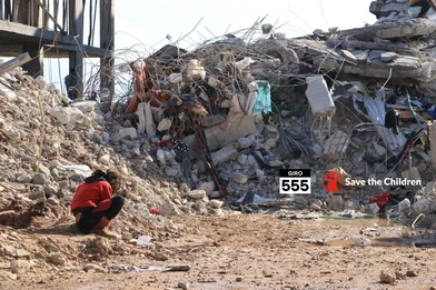 CH1771207-A-girl-sits-beside-destroyed-homes-in-North-West-Syria.png