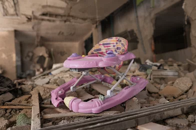 CH1909334-A-child-rocking-chair-among-a-rubble-in-Gaza