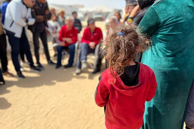 Young girl observing gathering