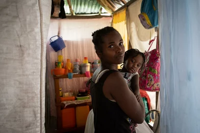 Ginette holds her daughter Loisa